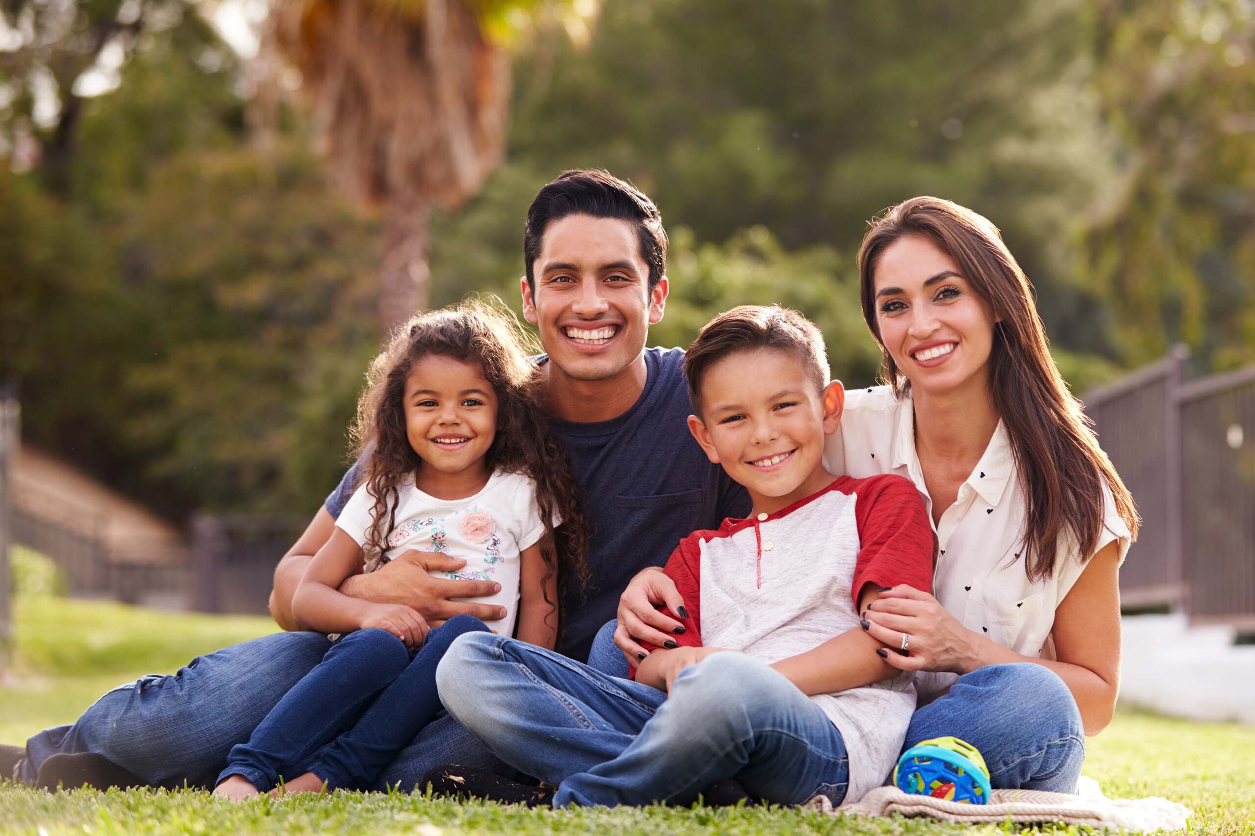 bigstock-Happy-young-Hispanic-family-si-278662498